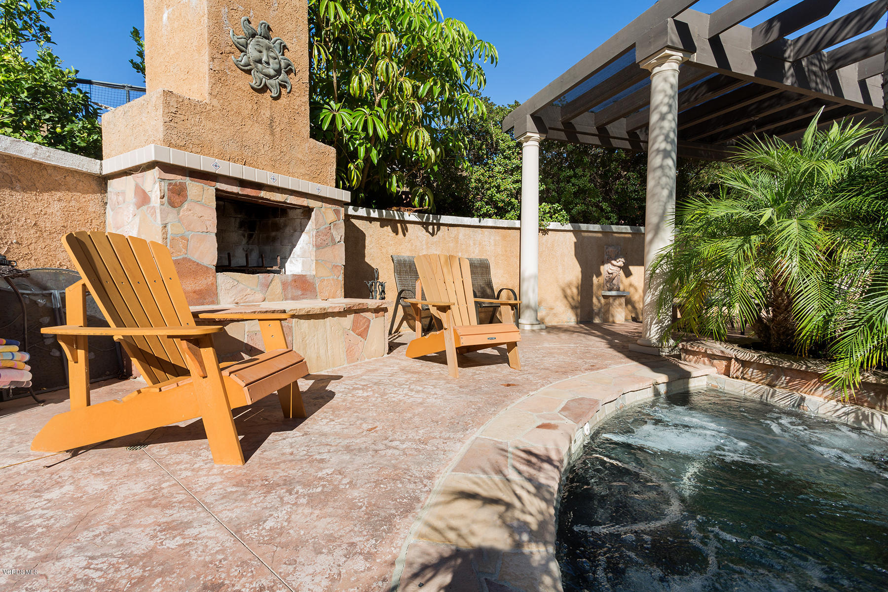 558 Rustic Hills Drive Simi Valley, CA 93065 - Photo 46 of 50 a view of a patio with table and chairs potted plants