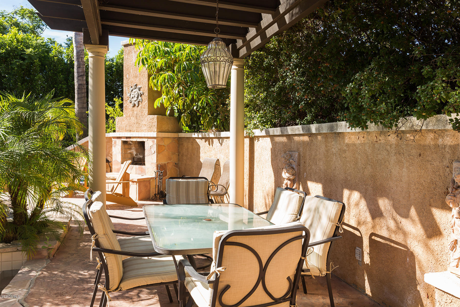 558 Rustic Hills Drive Simi Valley, CA 93065 - Photo 47 of 50 a view of a patio with table and chairs with wooden floor and fence