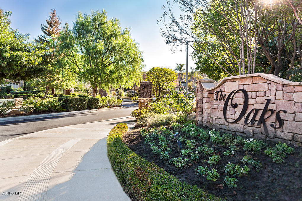 558 Rustic Hills Drive Simi Valley, CA 93065 - Photo 50 of 50 a view of a street with potted plants and a large tree
