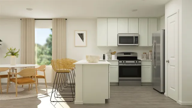 a kitchen with stainless steel appliances a stove a sink and a refrigerator