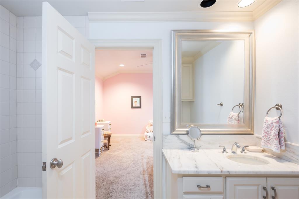 4422 Pomona Road Dallas, TX 75209 - Photo 25 of 34 a bathroom with a sink and a mirror