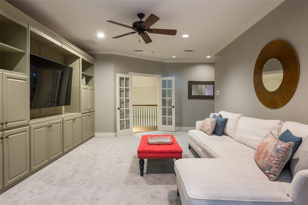 4422 Pomona Road Dallas, TX 75209 - Photo 26 of 34 a living room with furniture and a flat screen tv
