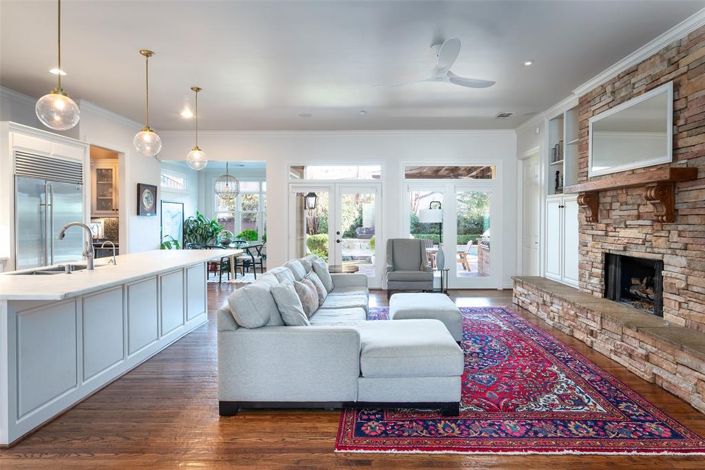 4422 Pomona Road Dallas, TX 75209 - Photo 3 of 34 a living room with furniture a large window and a fireplace