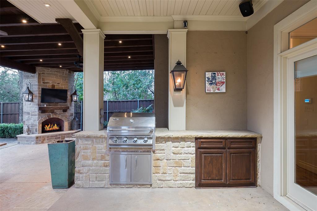 4422 Pomona Road Dallas, TX 75209 - Photo 34 of 34 a kitchen with stainless steel appliances kitchen island granite countertop a stove and a sink