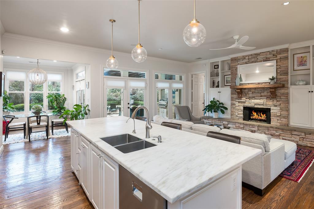 4422 Pomona Road Dallas, TX 75209 - Photo 4 of 34 a large kitchen with sink a counter space and stainless steel appliances