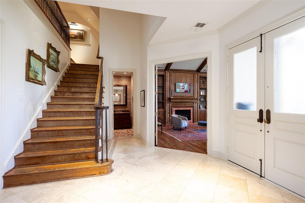 4422 Pomona Road Dallas, TX 75209 - Photo 9 of 34 a view of a livingroom with wooden floor and stairs