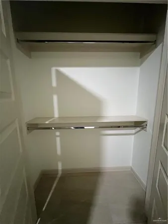 a view of a room with racks on the wall