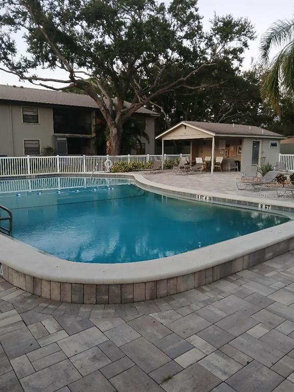 5787 Summerside Lane, Unit 4B Sarasota, FL 34231 - Photo 19 of 21 a view of a house with a yard