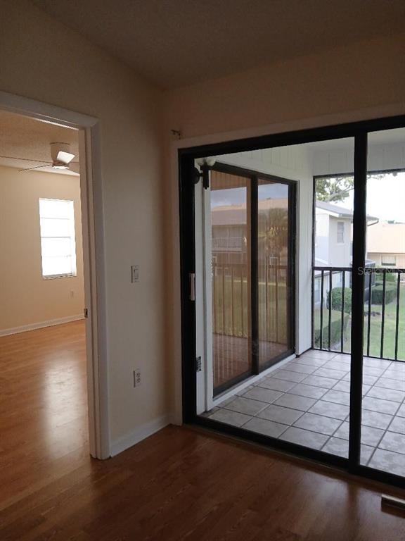 5787 Summerside Lane, Unit 4B Sarasota, FL 34231 - Photo 4 of 21 a room with sliding door