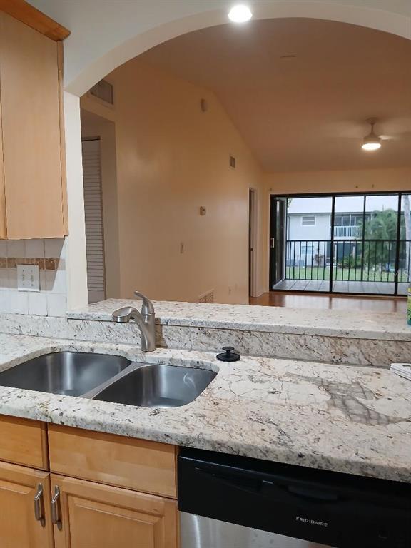 5787 Summerside Lane, Unit 4B Sarasota, FL 34231 - Photo 6 of 21 a view of a kitchen sink and dishwasher