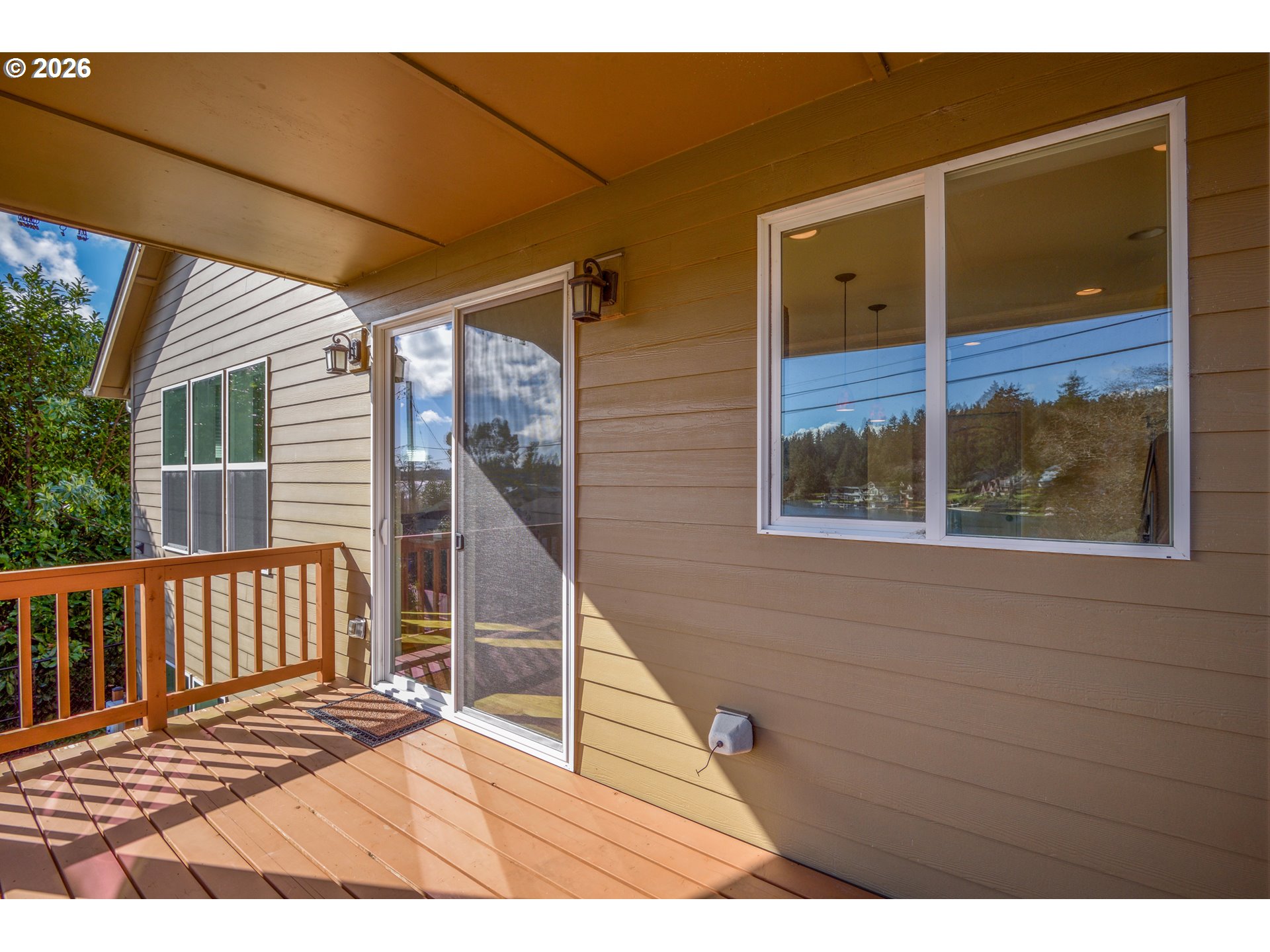 5300 Northeast 49th Street Neotsu, OR 97364 - Photo 16 of 48 a view of a balcony with wooden floor and fence