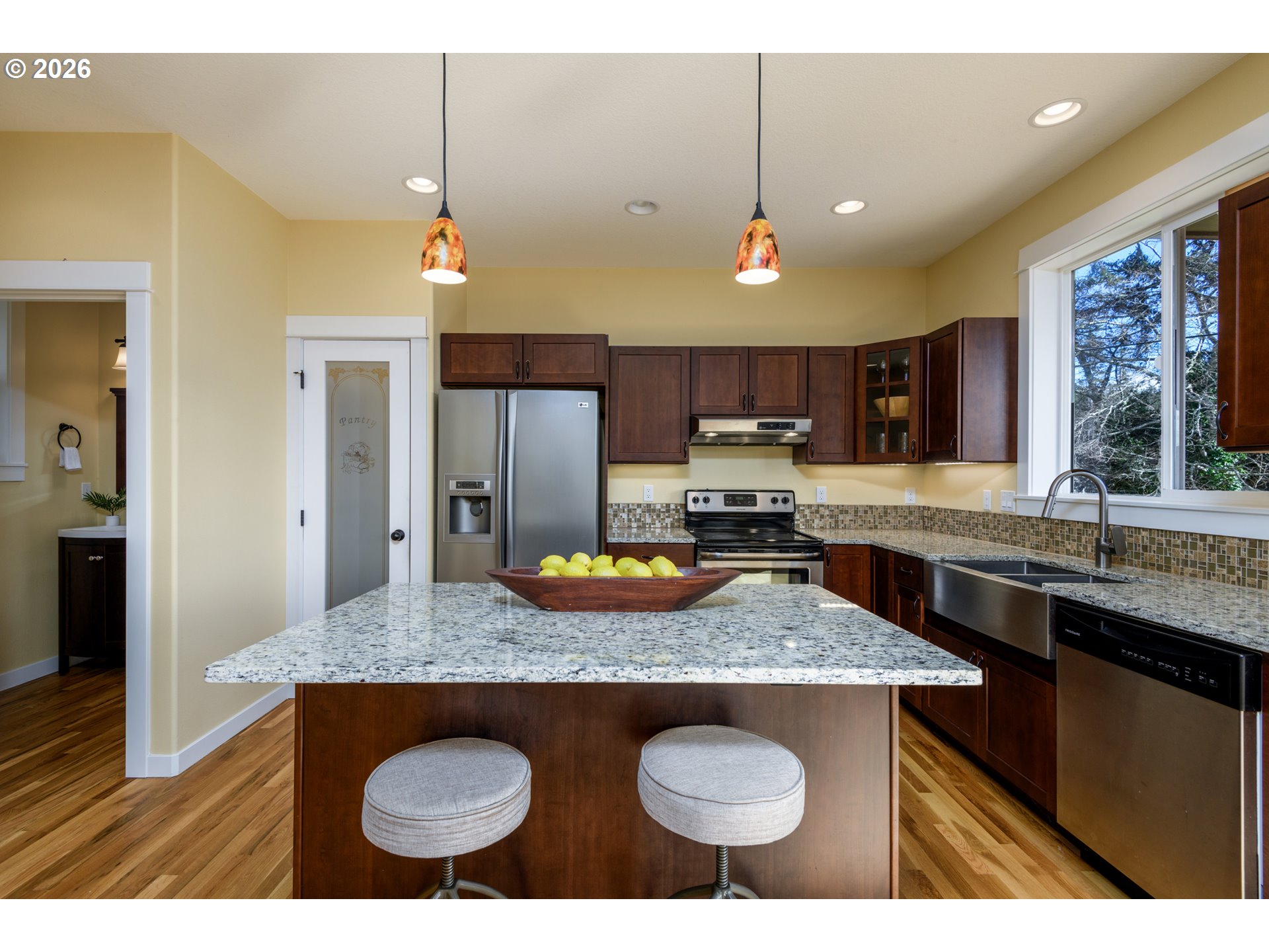5300 Northeast 49th Street Neotsu, OR 97364 - Photo 23 of 48 a kitchen with granite countertop a sink a counter space appliances and cabinets