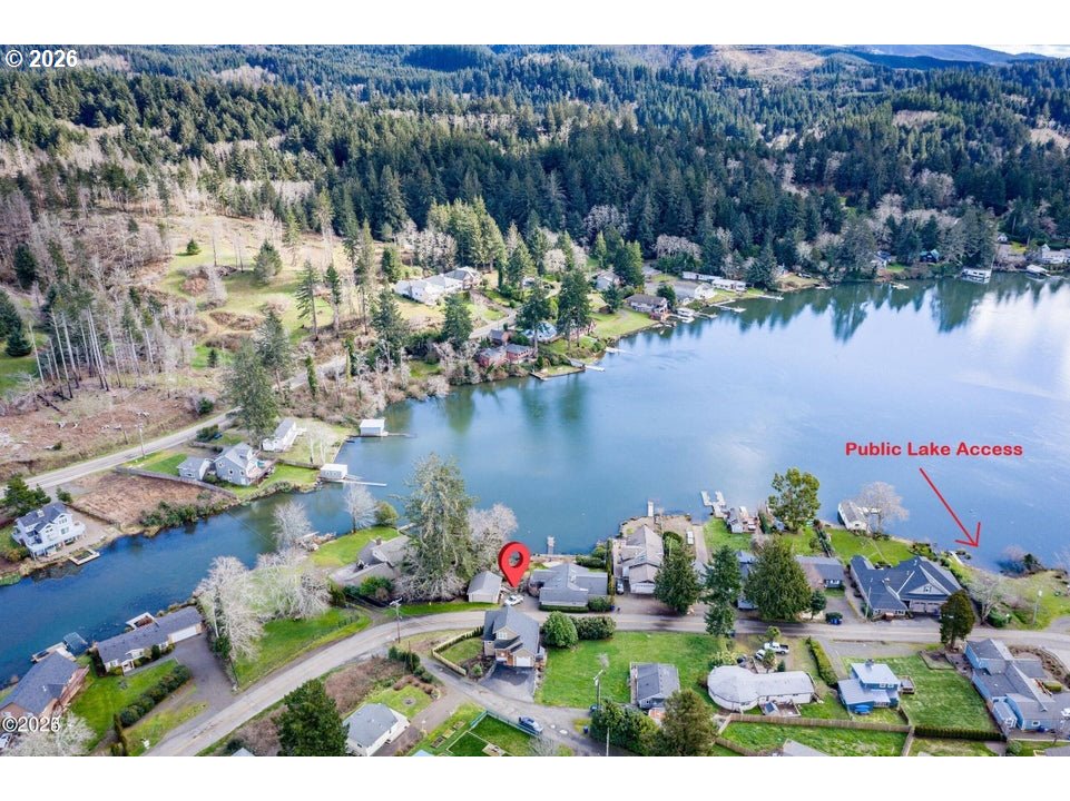 5300 Northeast 49th Street Neotsu, OR 97364 - Photo 3 of 48 a view of a lake with a mountain in the background