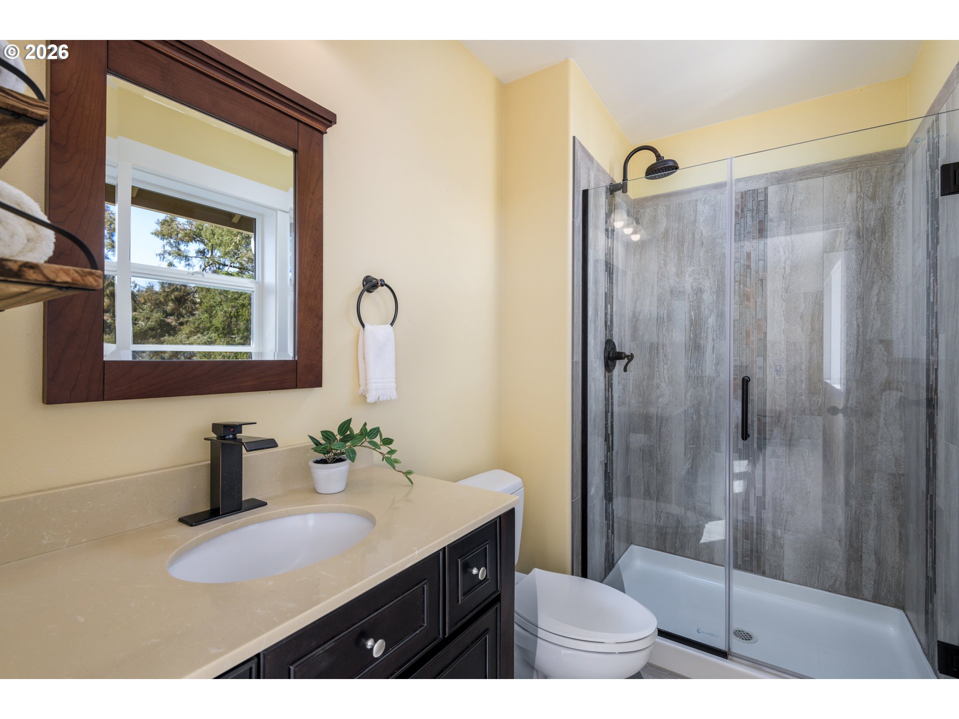 5300 Northeast 49th Street Neotsu, OR 97364 - Photo 31 of 48 a bathroom with a sink a toilet and shower