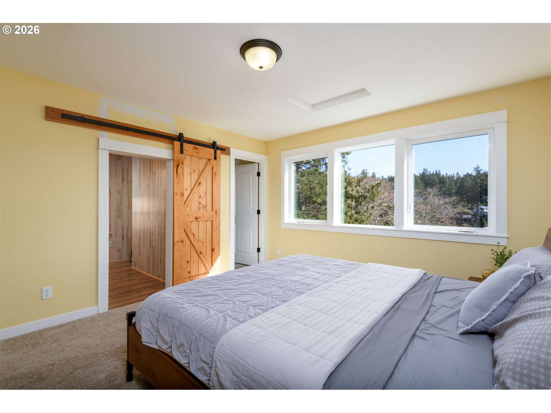 5300 Northeast 49th Street Neotsu, OR 97364 - Photo 33 of 48 a bedroom with a bed and a window