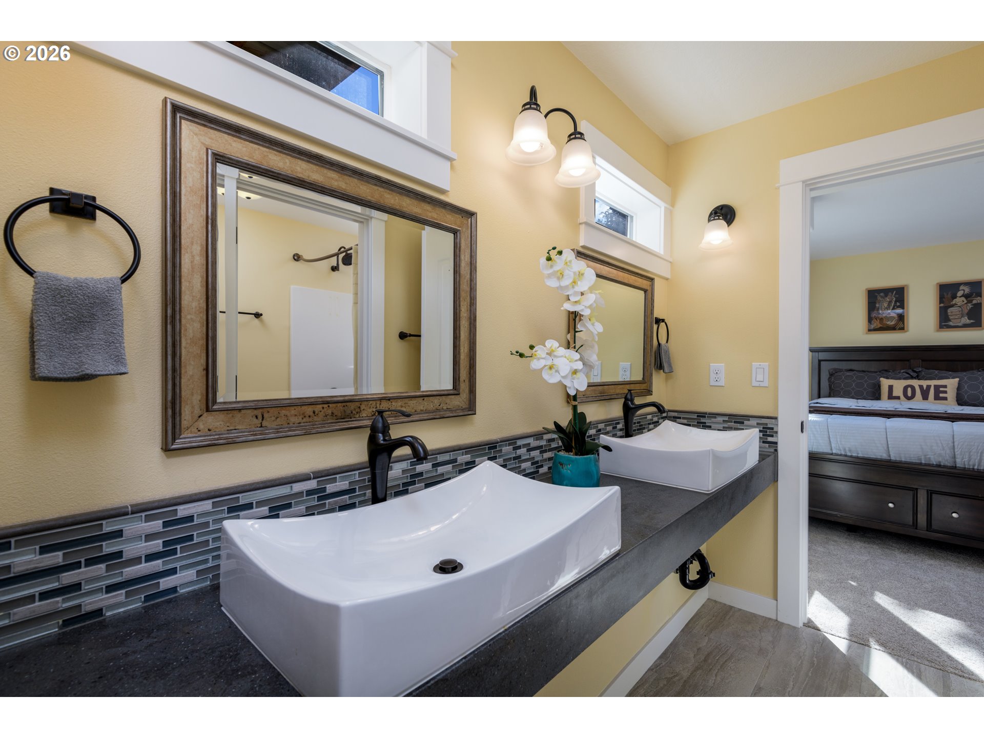 5300 Northeast 49th Street Neotsu, OR 97364 - Photo 36 of 48 a en suite bathroom with a sink double vanity and a mirror