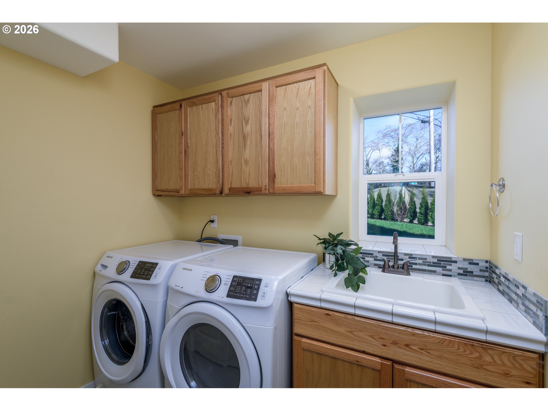 5300 Northeast 49th Street Neotsu, OR 97364 - Photo 41 of 48 a bathroom with a sink a washer and dryer