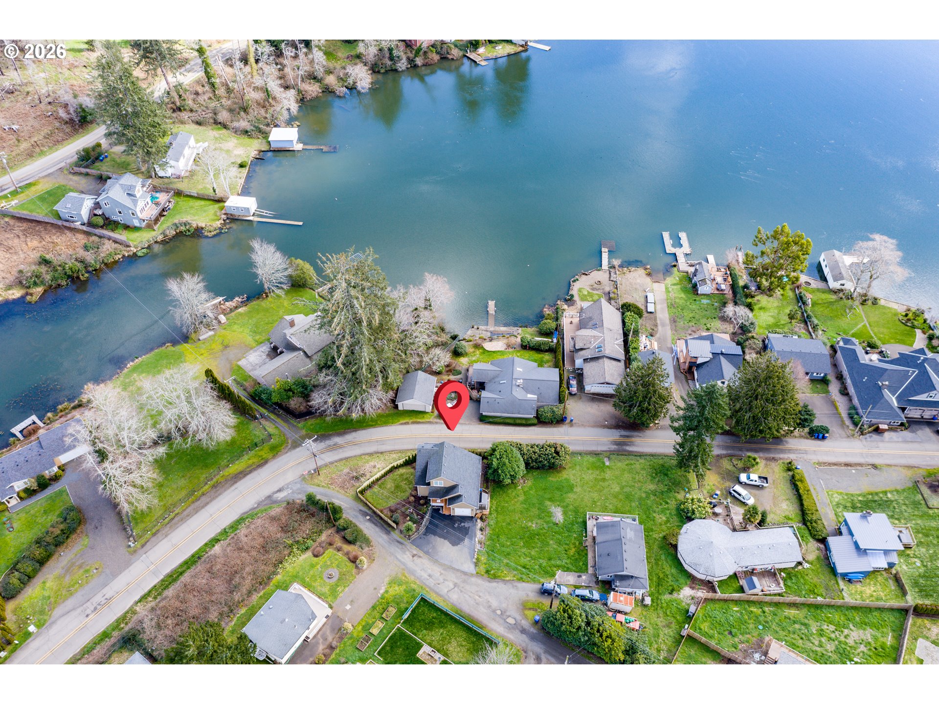 5300 Northeast 49th Street Neotsu, OR 97364 - Photo 46 of 48 a bathroom with a sink mirror and painting on wall