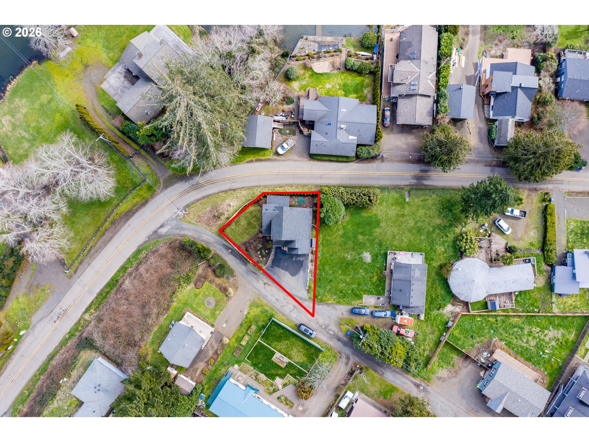 5300 Northeast 49th Street Neotsu, OR 97364 - Photo 47 of 48 an aerial view of a house with a garden and swimming pool