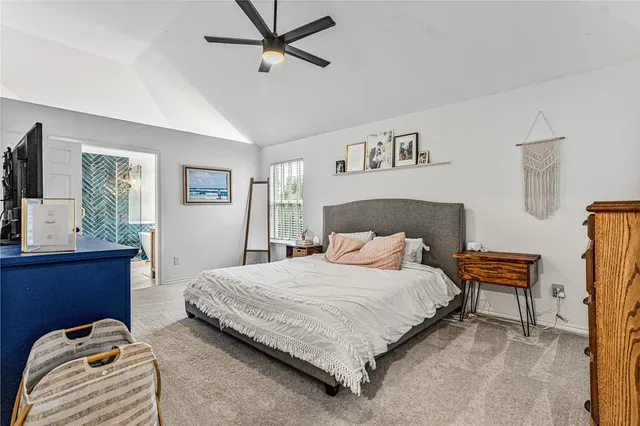 a bedroom with a bed and dresser