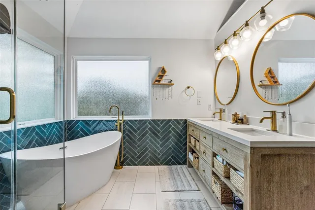 a bathroom with a double vanity sink and a mirror