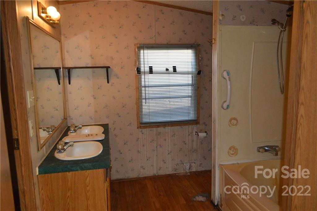 522 Gilreath Loop Road Mills River, NC 28759 - Photo 5 of 15 a bathroom with a sink and a mirror