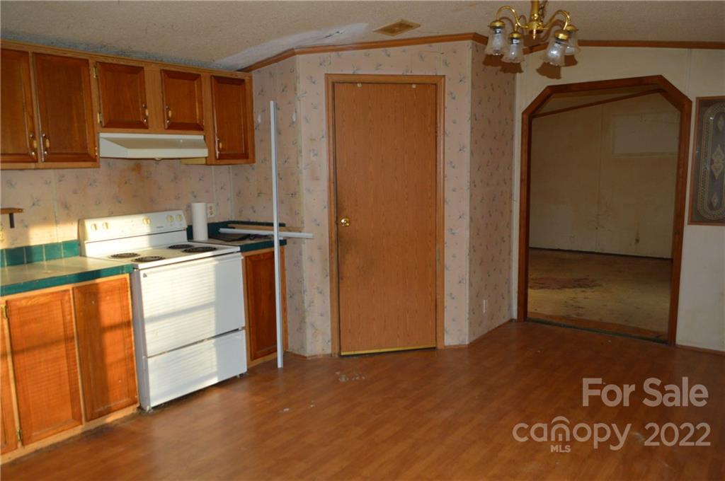 522 Gilreath Loop Road Mills River, NC 28759 - Photo 9 of 15 a kitchen with stainless steel appliances granite countertop a refrigerator a stove and a sink