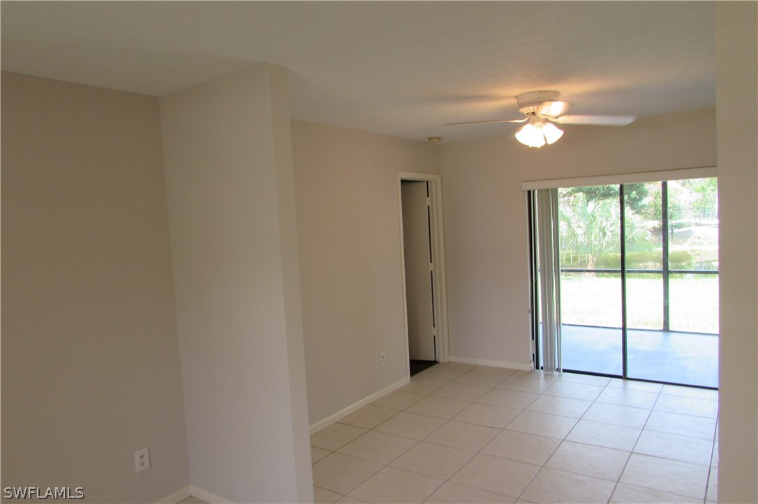 4983 18th Court Southwest Naples, FL 34116 - Photo 11 of 25 a view of an empty room with a window
