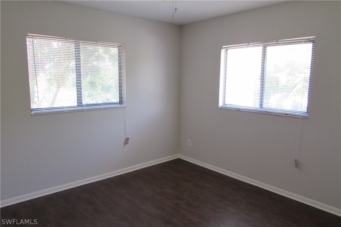 4983 18th Court Southwest Naples, FL 34116 - Photo 13 of 25 an empty room with a window