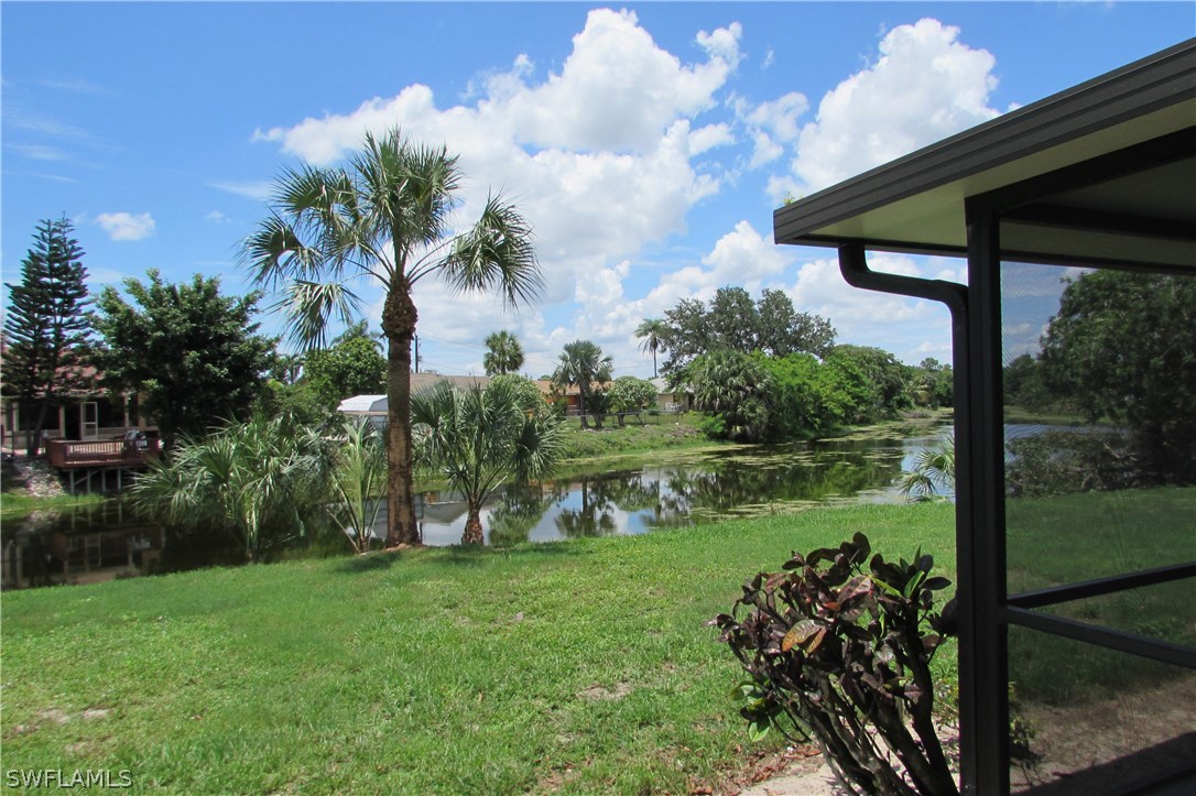 4983 18th Court Southwest Naples, FL 34116 - Photo 16 of 25 a backyard of a house with lots of green space