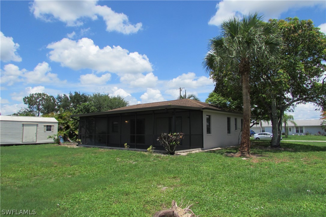 4983 18th Court Southwest Naples, FL 34116 - Photo 18 of 25 a view of a backyard with a garden
