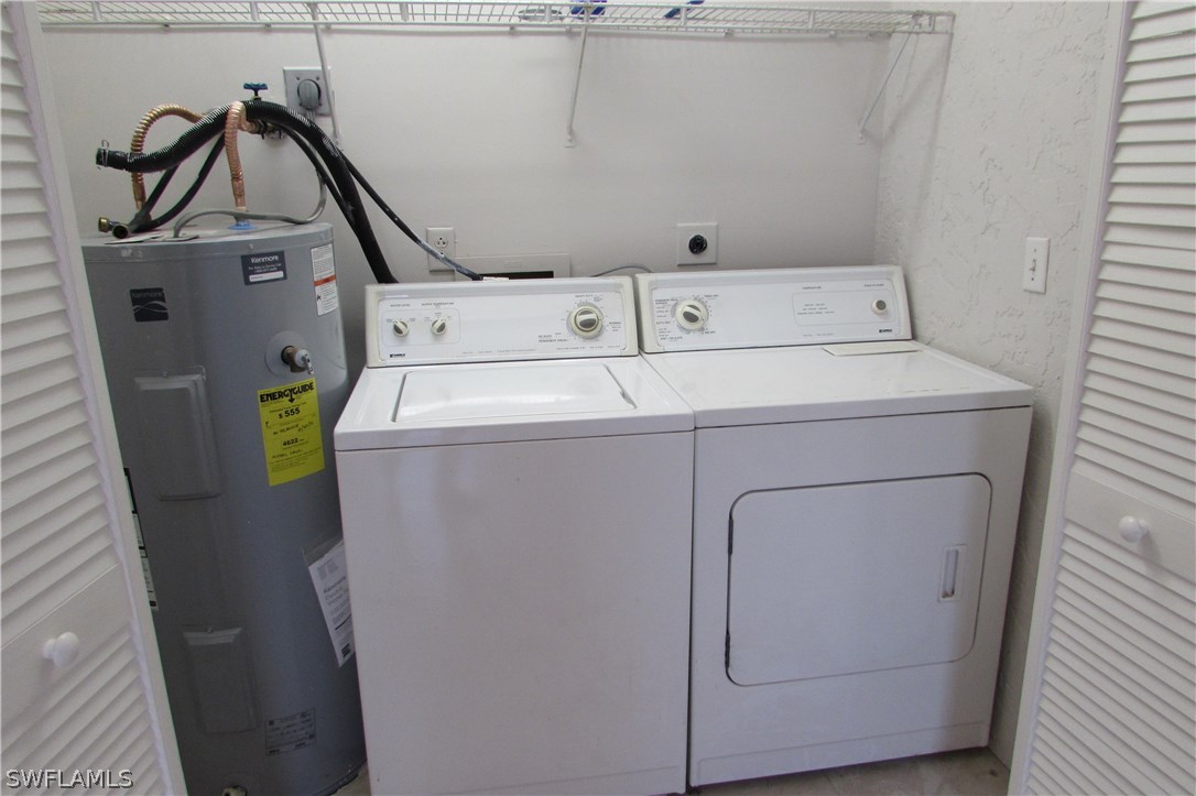 4983 18th Court Southwest Naples, FL 34116 - Photo 25 of 25 a utility room with dryer and washer
