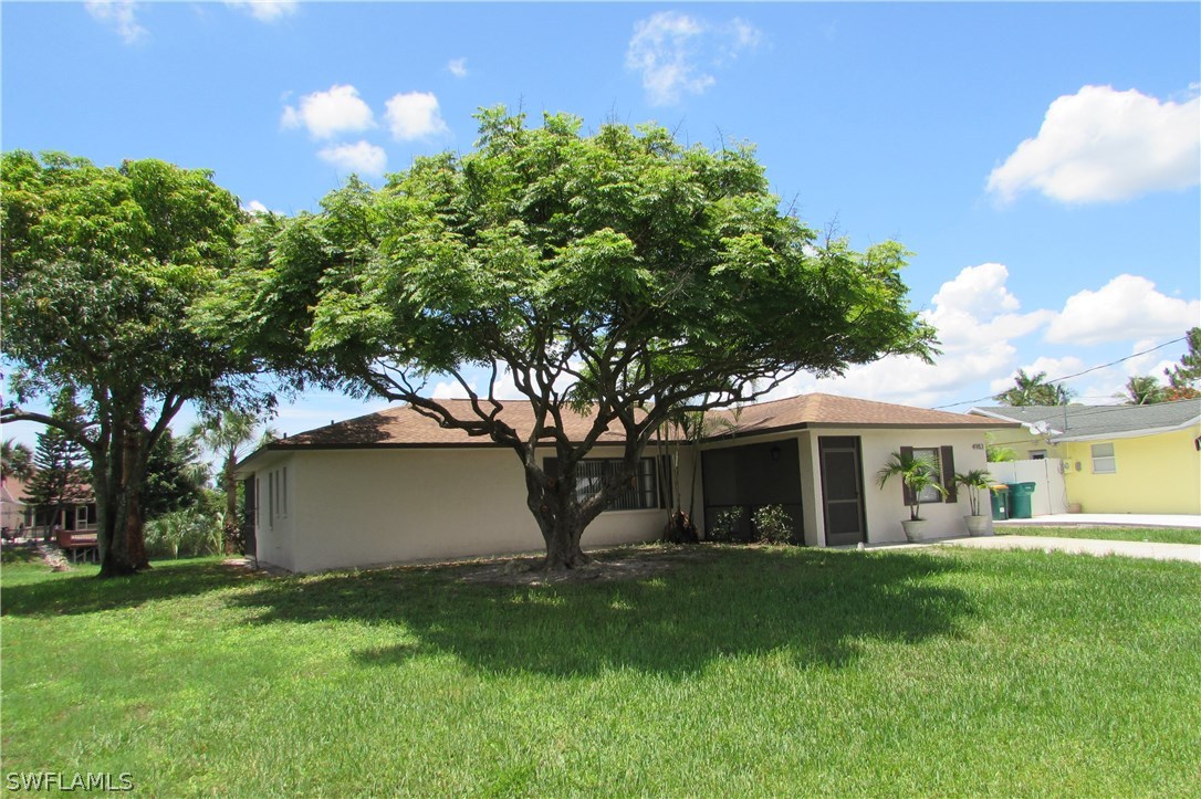 4983 18th Court Southwest Naples, FL 34116 - Photo 3 of 25 a view of house with a yard