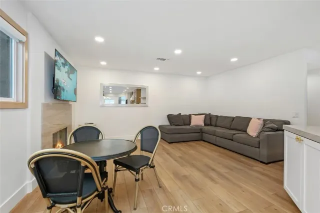 a living room with furniture and a chair