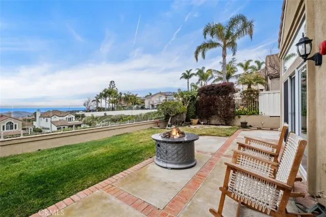 a view of a patio with couches and potted plants