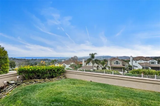 a view of a backyard with sitting area