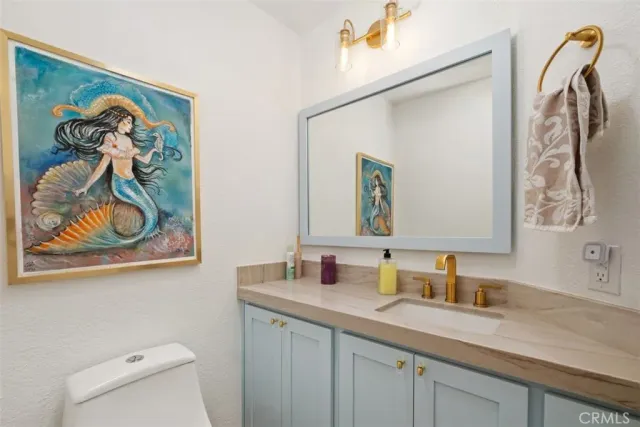 a view of a house with backyard porch and sitting area