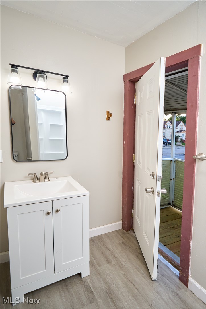 5432 State Road Parma, OH 44134 - Photo 34 of 47 Bathroom featuring light wood-type flooring and vanity