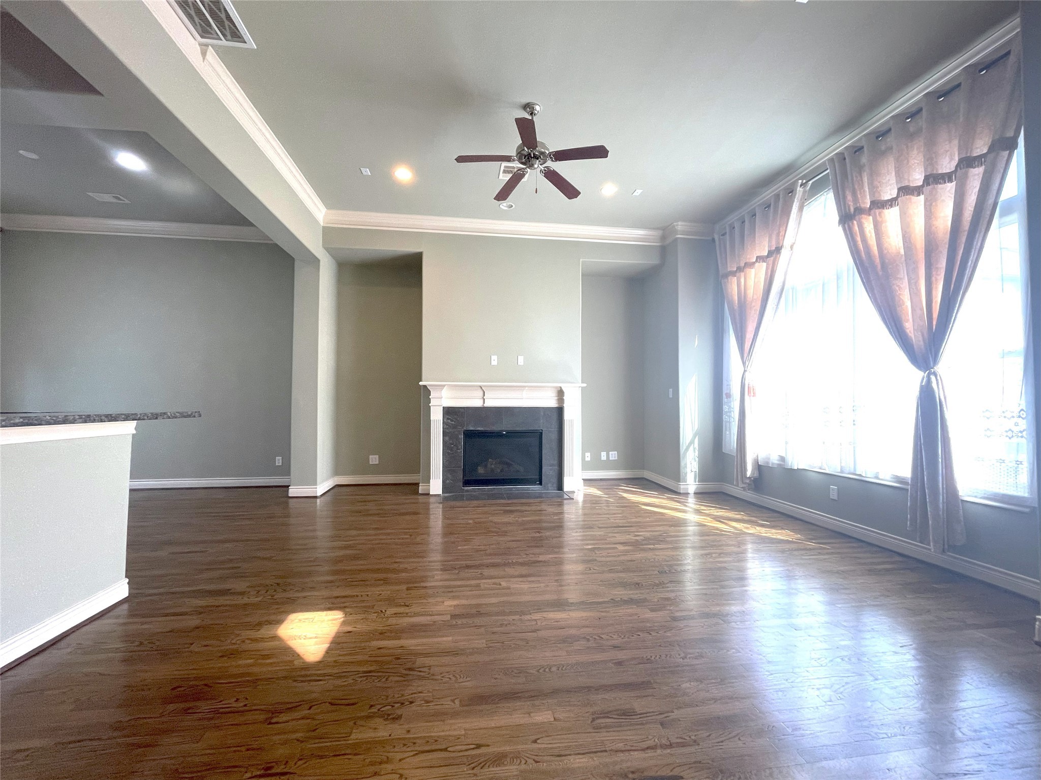 3138 Pemberton Walk Houston, TX 77025 - Photo 11 of 27 an empty room with wooden floor chandelier and glass door