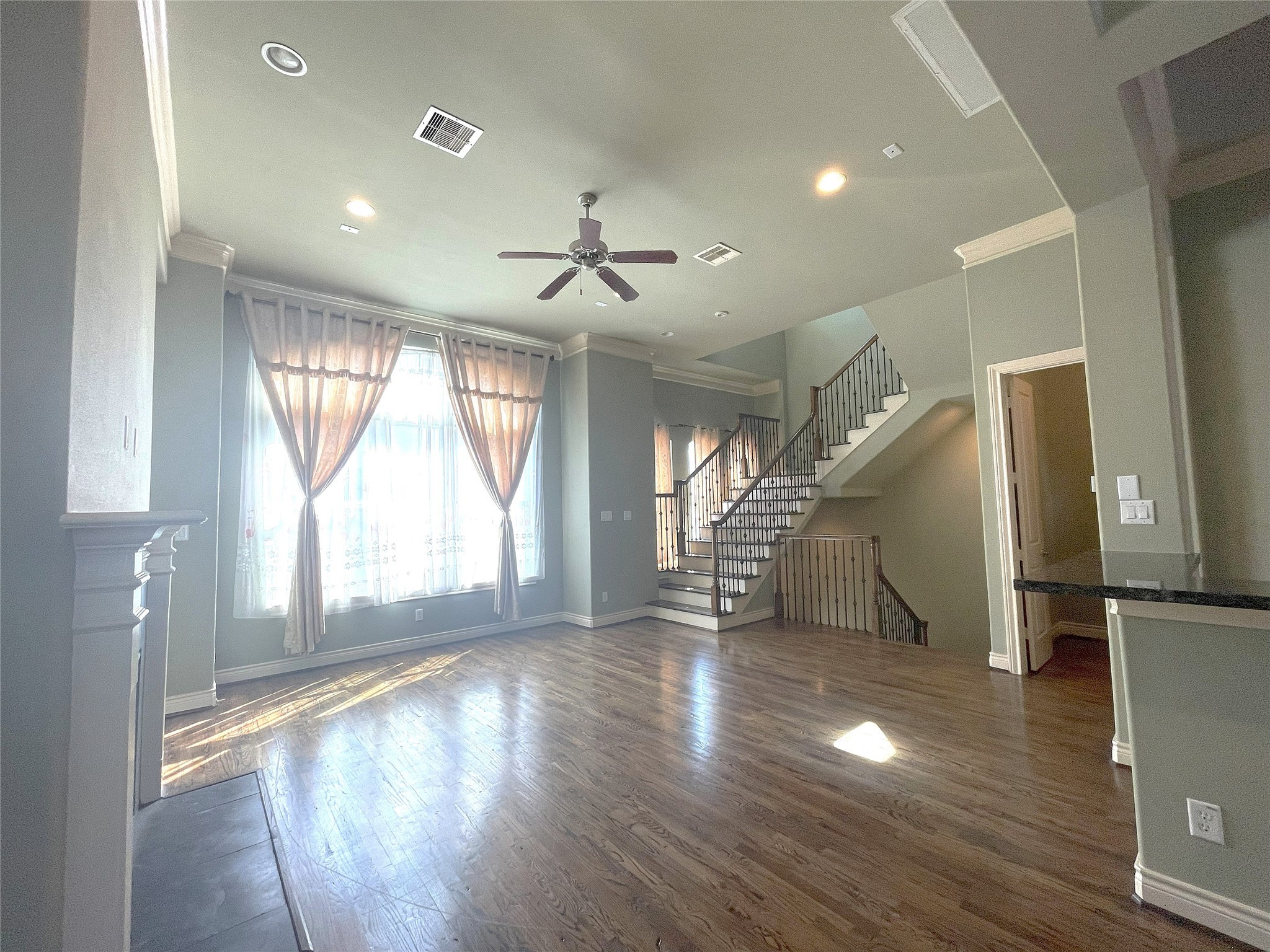 3138 Pemberton Walk Houston, TX 77025 - Photo 13 of 27 an empty room with wooden floor and windows