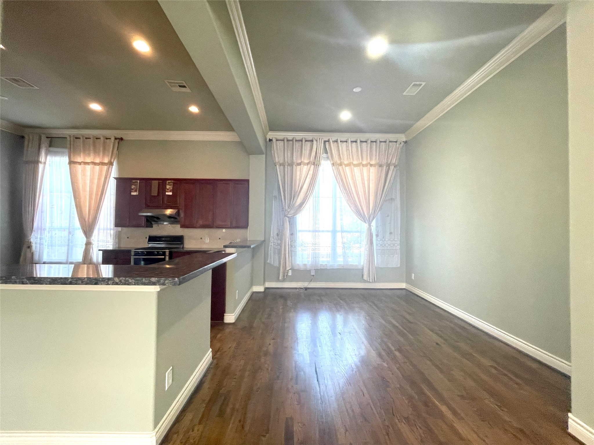 3138 Pemberton Walk Houston, TX 77025 - Photo 14 of 27 a kitchen with stainless steel appliances granite countertop a stove and a large window