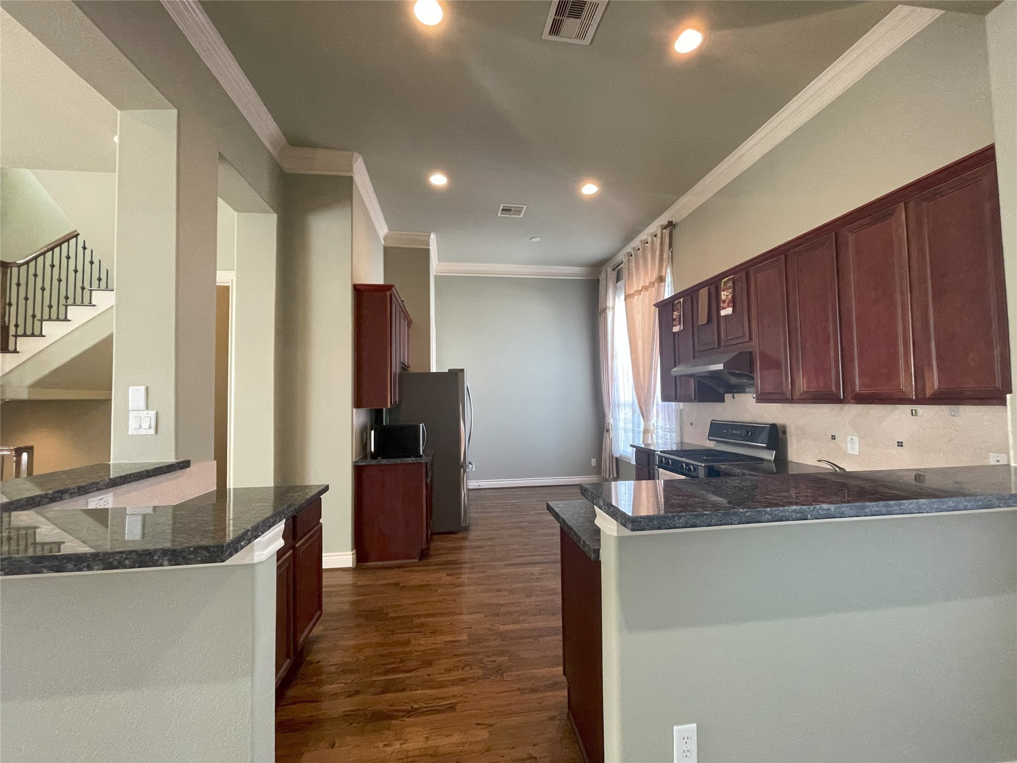 3138 Pemberton Walk Houston, TX 77025 - Photo 15 of 27 a kitchen with stainless steel appliances granite countertop a sink stove and refrigerator