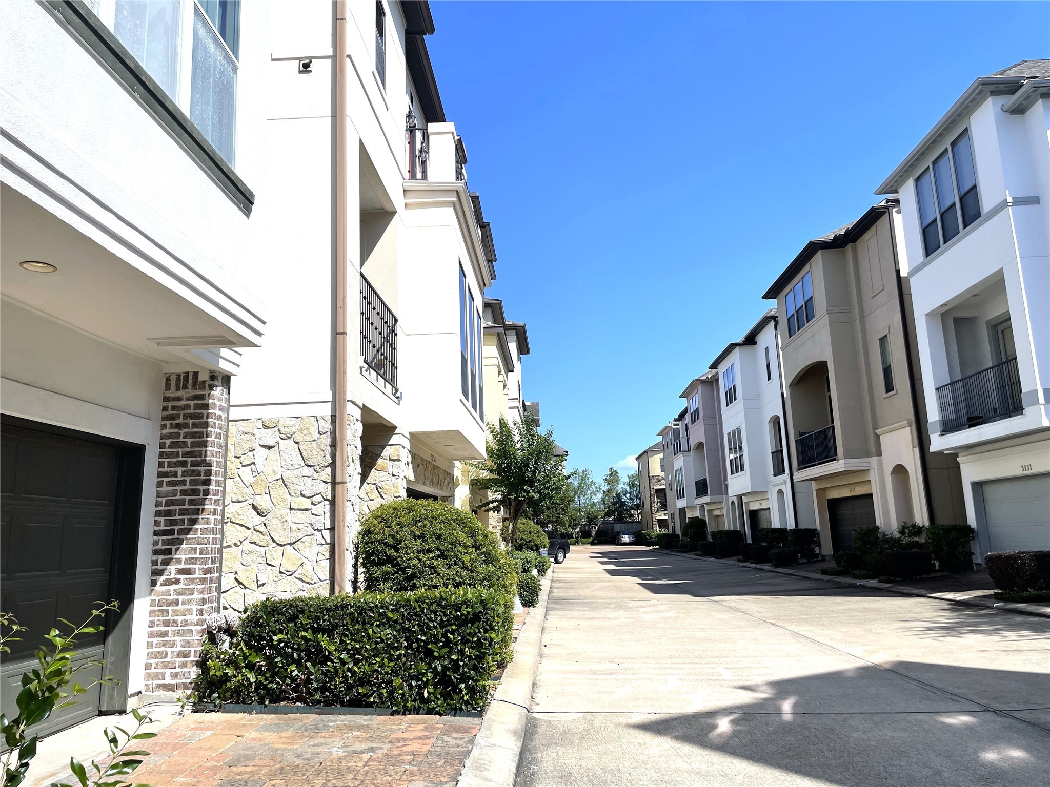 3138 Pemberton Walk Houston, TX 77025 - Photo 2 of 27 a view of a street with buildings