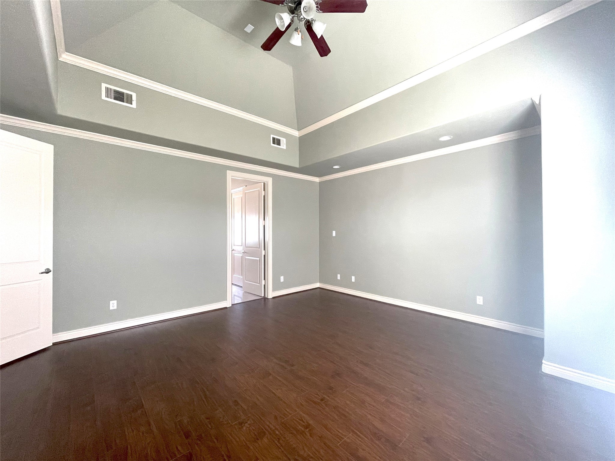 3138 Pemberton Walk Houston, TX 77025 - Photo 21 of 27 an empty room with wooden floor fan and windows