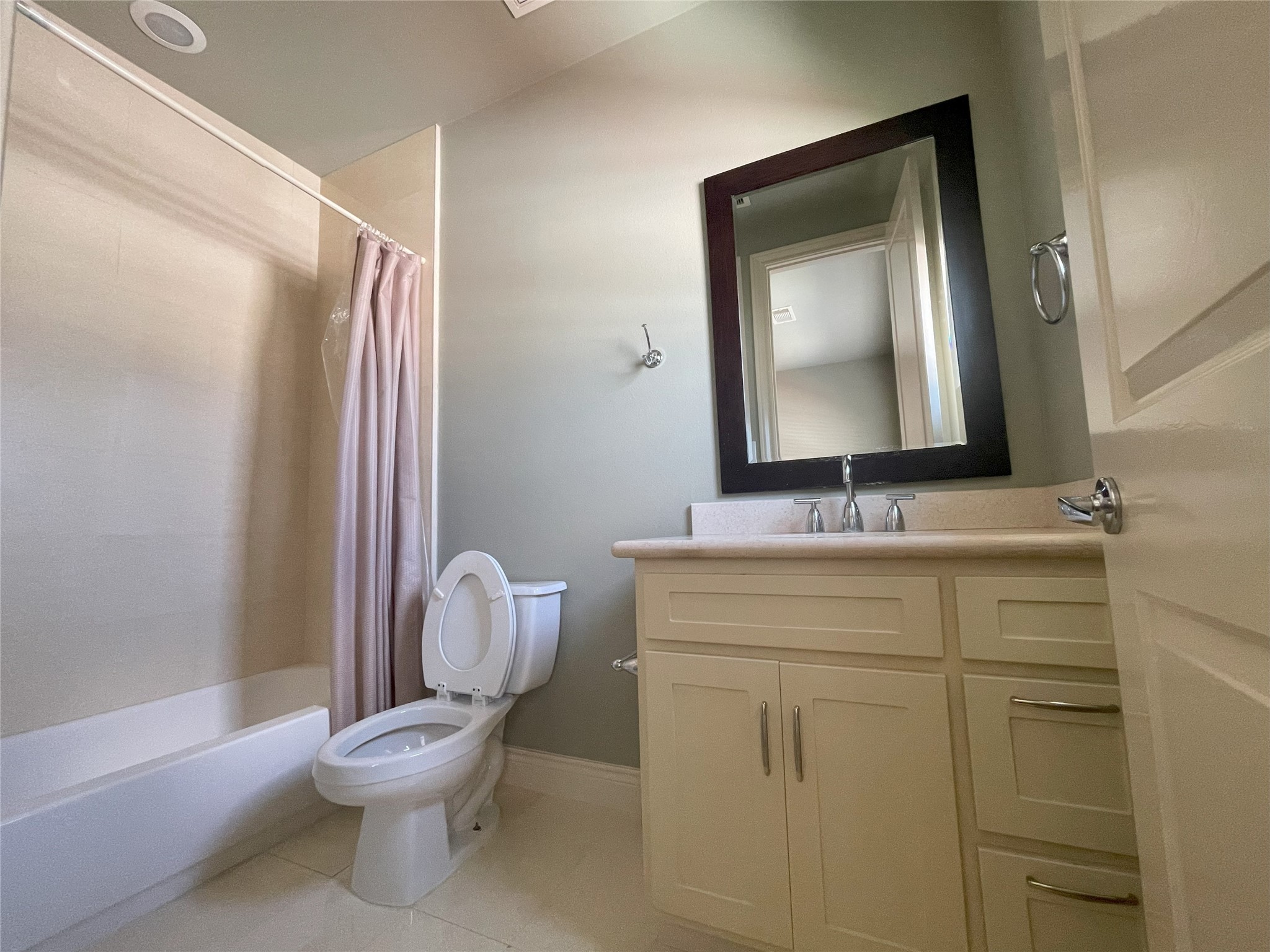 3138 Pemberton Walk Houston, TX 77025 - Photo 25 of 27 a bathroom with a toilet sink and mirror