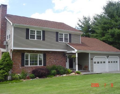 101 Lazy Brook Road Monroe, CT 06468 - Photo 1 of 1 a front view of a house with a yard and trees