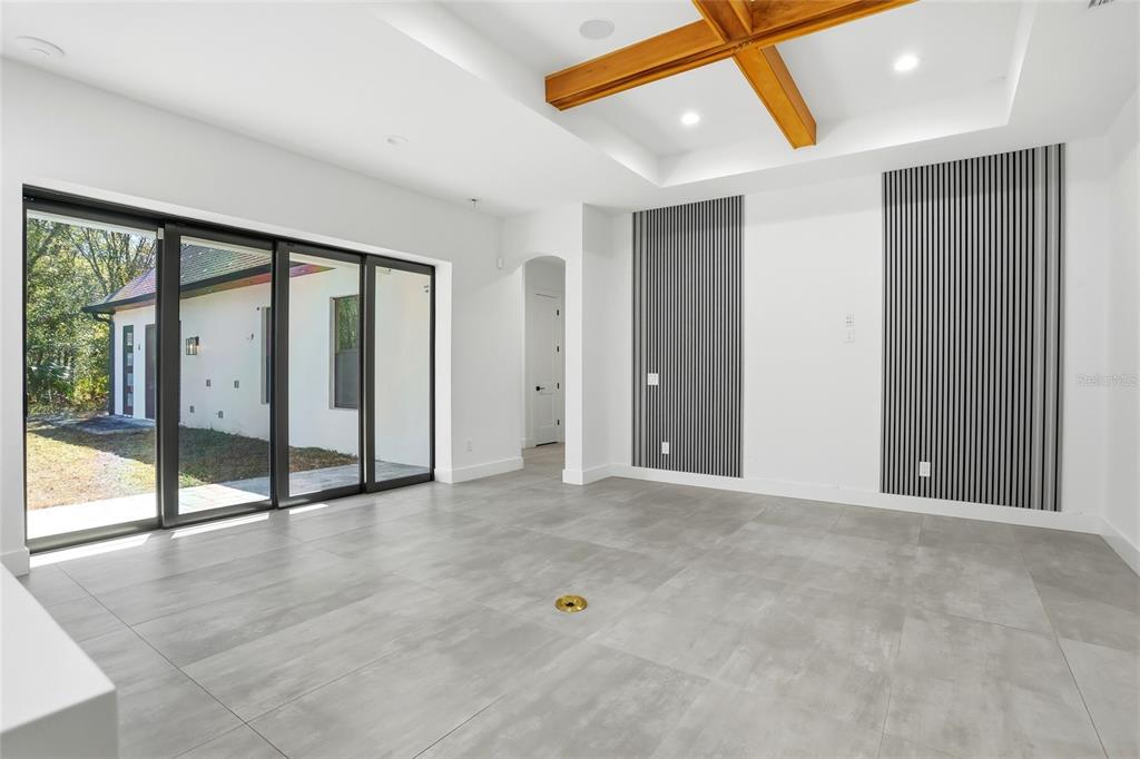 16728 Bearle Road Orlando, FL 32828 - Photo 19 of 72 a view of an empty room with wooden floor and a window