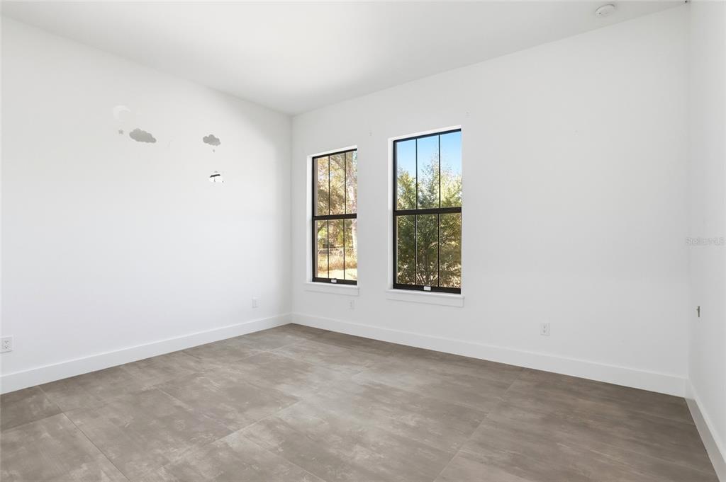 16728 Bearle Road Orlando, FL 32828 - Photo 24 of 72 an empty room with windows