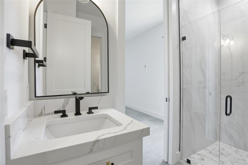 16728 Bearle Road Orlando, FL 32828 - Photo 27 of 72 a bathroom with a sink and a mirror