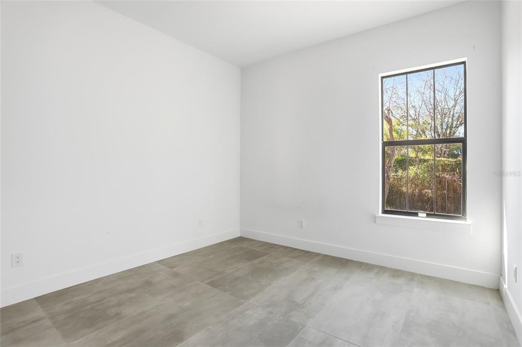 16728 Bearle Road Orlando, FL 32828 - Photo 31 of 72 an empty room with a window